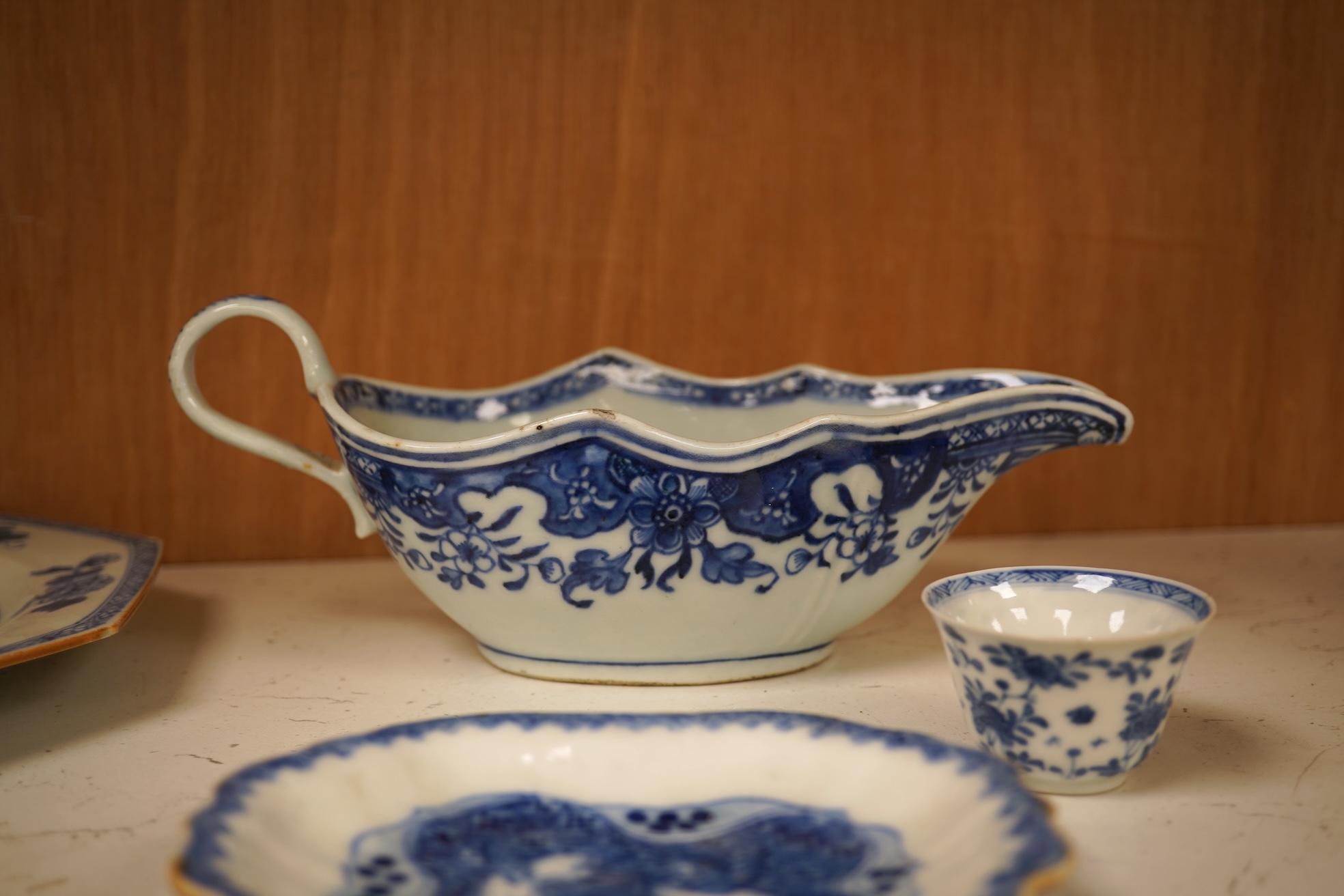 A Chinese export blue and white blue plate, sauceboat and Ko-sometsuke type dish together with a miniature tea bowl and two saucers. Plate 22cm diameter